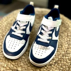 Nike low top 13C navy blue and white tennis shoes.